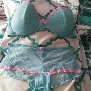 Blue bra and panties set with pink trim.